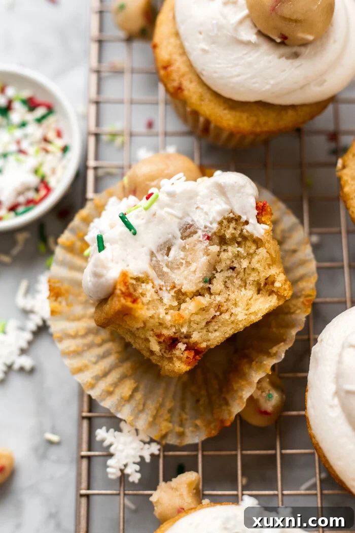 bite out of vegan sugar cookie dough cupcake with sprinkles