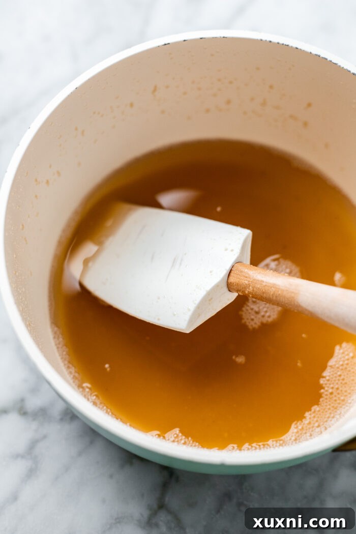 Easy Soft and Chewy Vegan Oatmeal Cream Pies 5 Vegan butter browning in a small saucepan on the stove