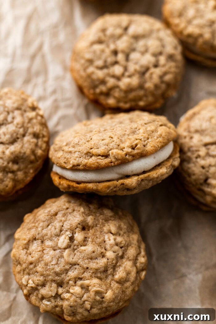 Easy Soft and Chewy Vegan Oatmeal Cream Pies 10 Vegan oatmeal cream pies with frosting piped between two cookies