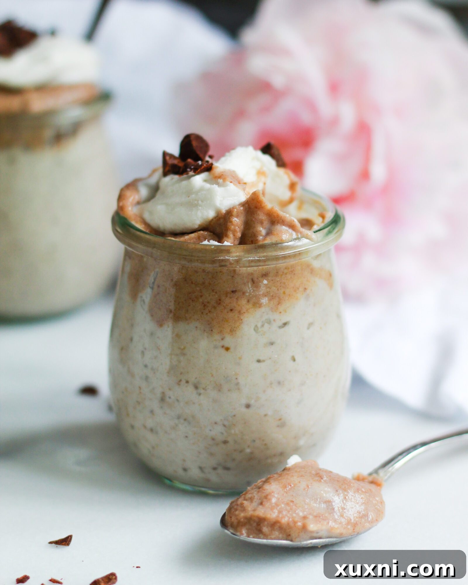 A single jar of perfectly set vegan butterscotch pudding, presented elegantly for serving, highlighting its smooth and inviting texture.