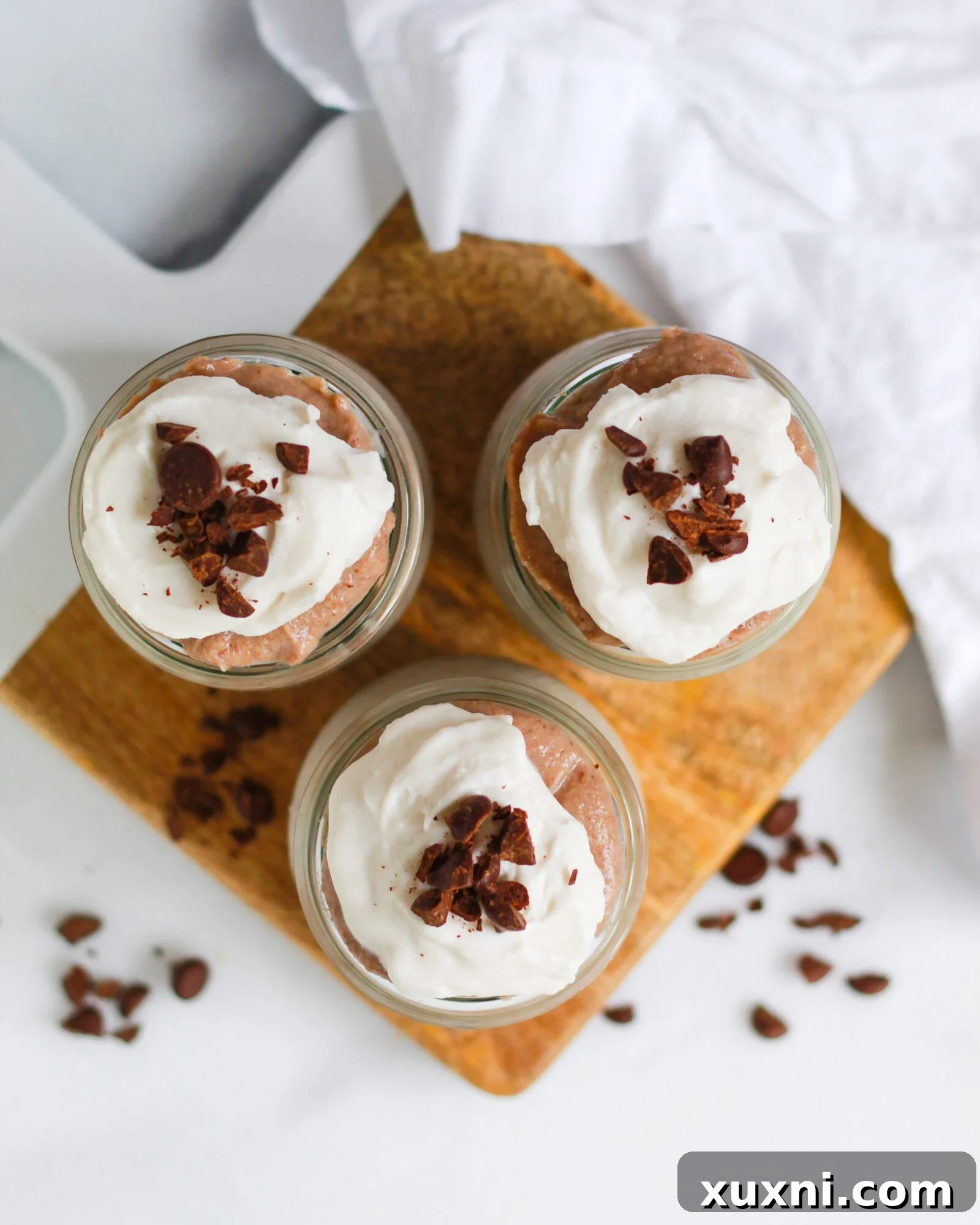 An inviting overhead shot showcasing the smooth, golden texture of vegan butterscotch pudding in a serving dish, highlighting its rich appeal.