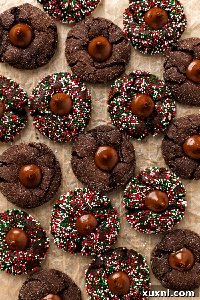 Delightful vegan chocolate blossoms arranged on parchment paper, showcasing their fudgy texture and homemade chocolate kisses.