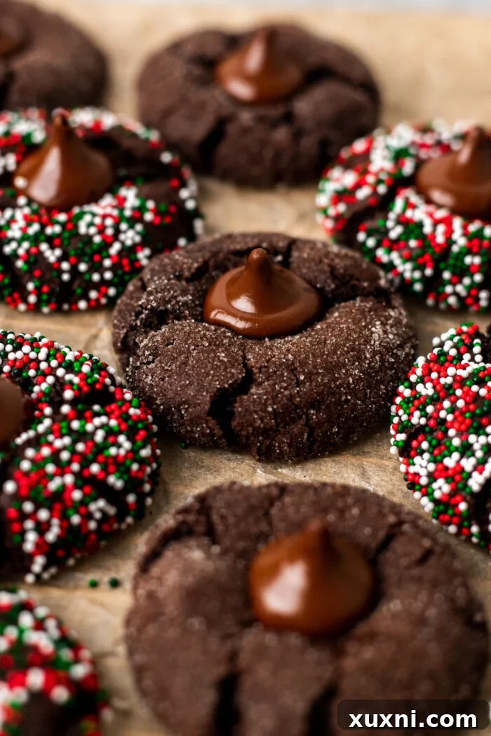 Close-up of vegan chocolate blossoms on parchment paper, perfectly round and ready for serving.