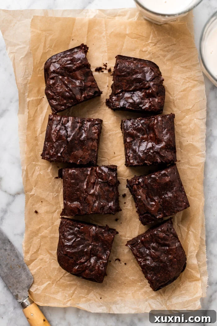 Vegan Small Batch Caramel Nut Brownies 3 Sliced vegan brownies arranged beautifully on parchment paper