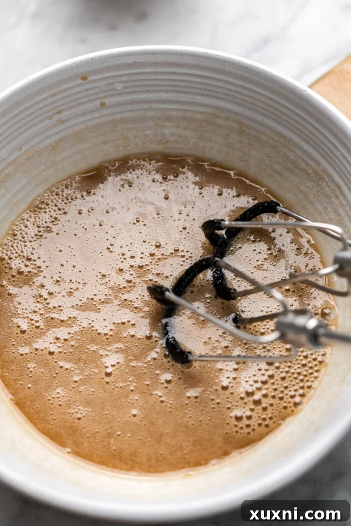 Vegan Small Batch Caramel Nut Brownies 8 Step 3: Whisking wet ingredients for brownie batter with a hand mixer