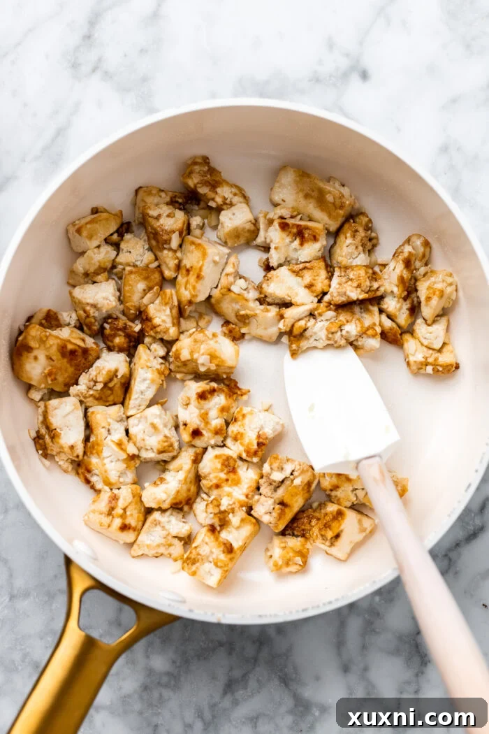 sautéing the tofu with the garlic