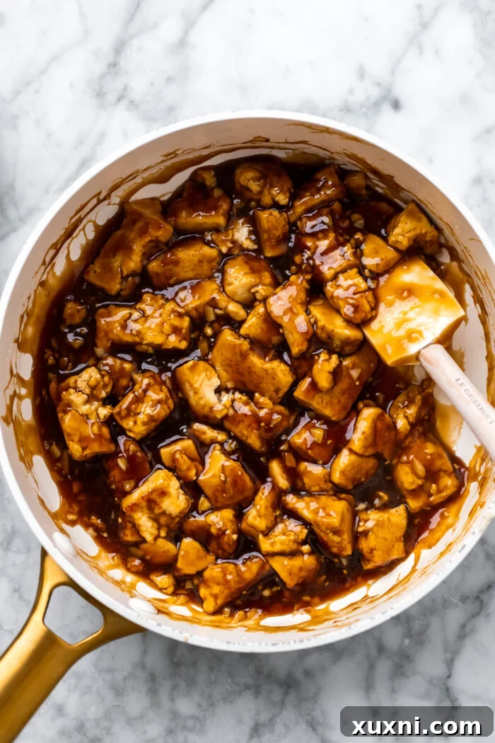 sautéing the tofu in a pan