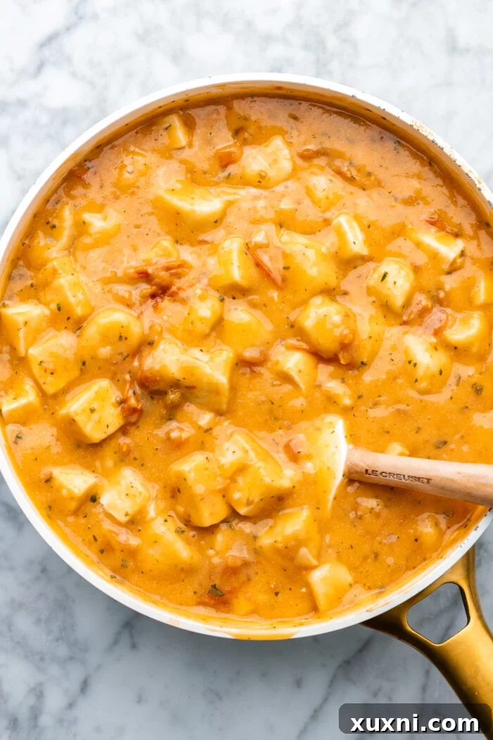 crispy tofu and gnocchi being tossed in the marry me sauce