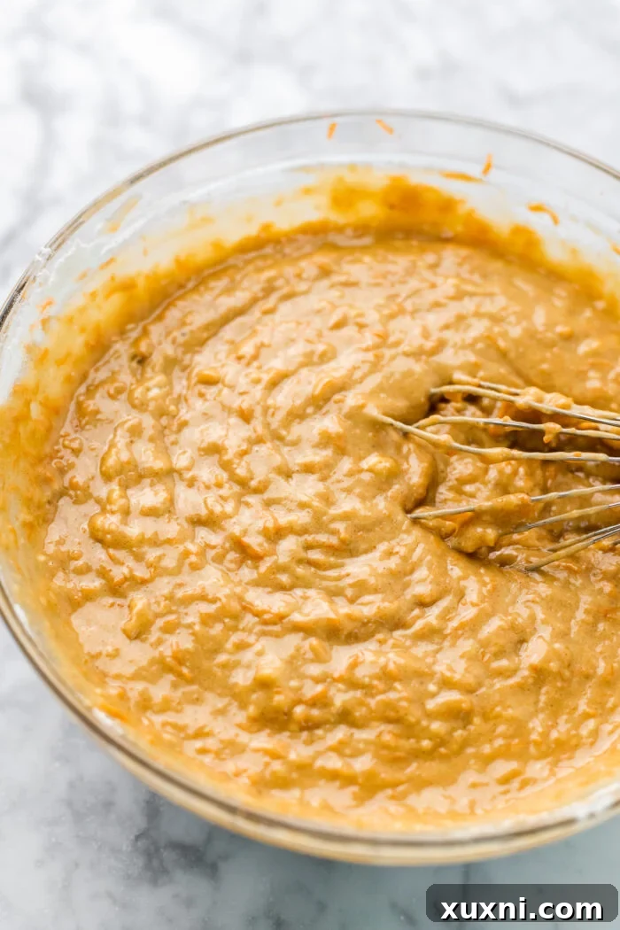 Smooth carrot cake loaf batter ready for baking.