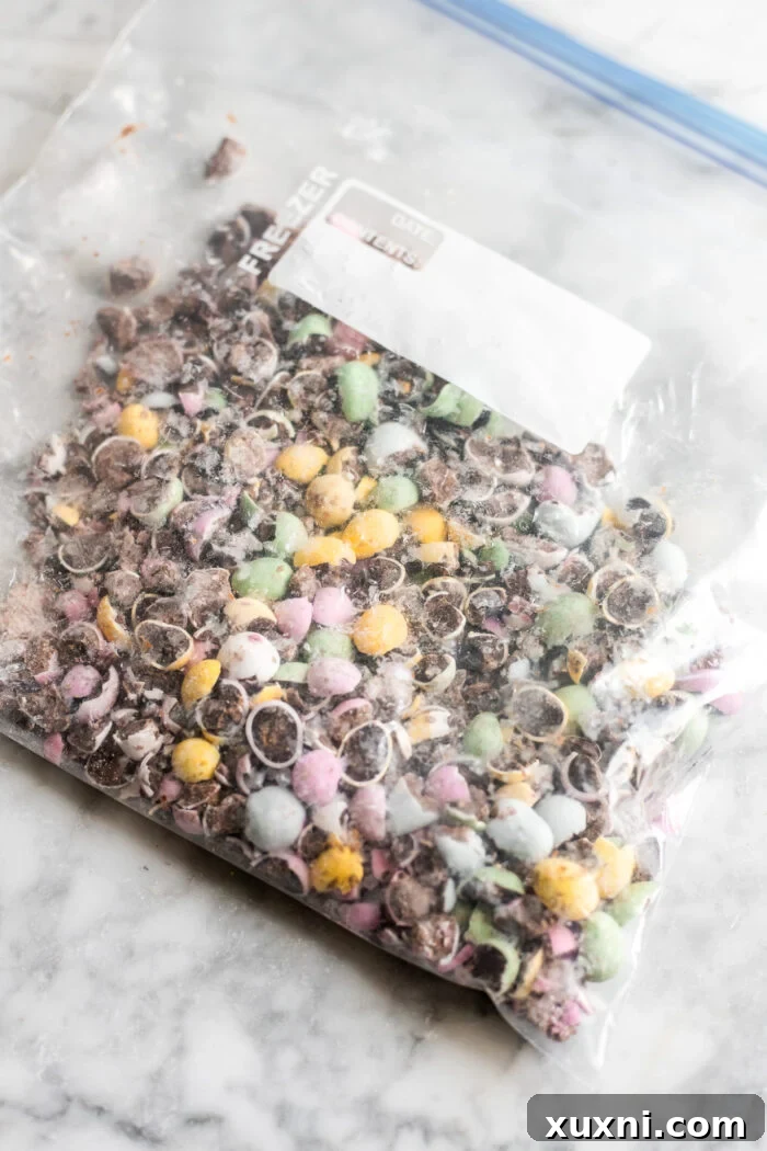 Crushed Easter egg candy pieces in a bowl, ready to be incorporated into the cheesecake batter