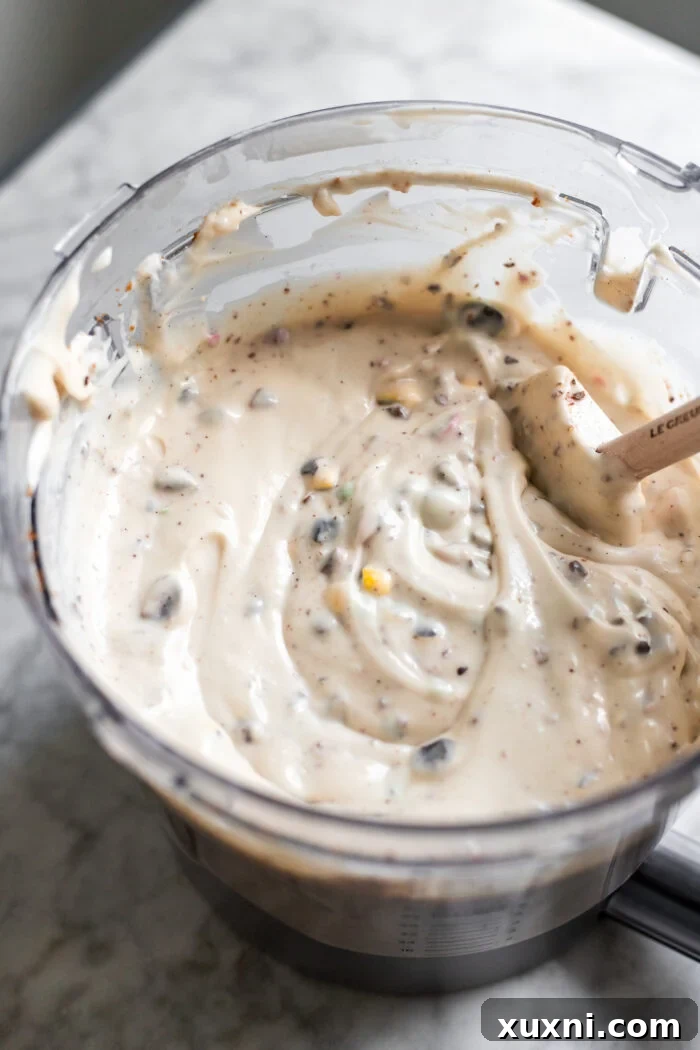 Vegan Easter egg cheesecake batter in a mixing bowl, smooth and creamy