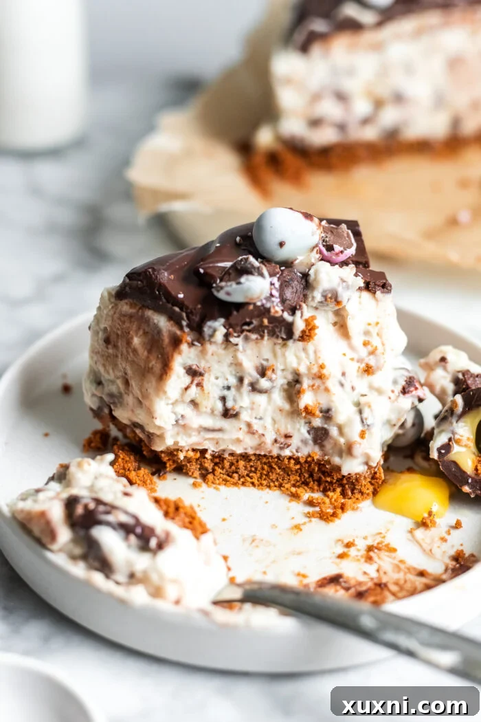 A close-up of a bitten slice of vegan Easter egg cheesecake with a clear focus on the texture