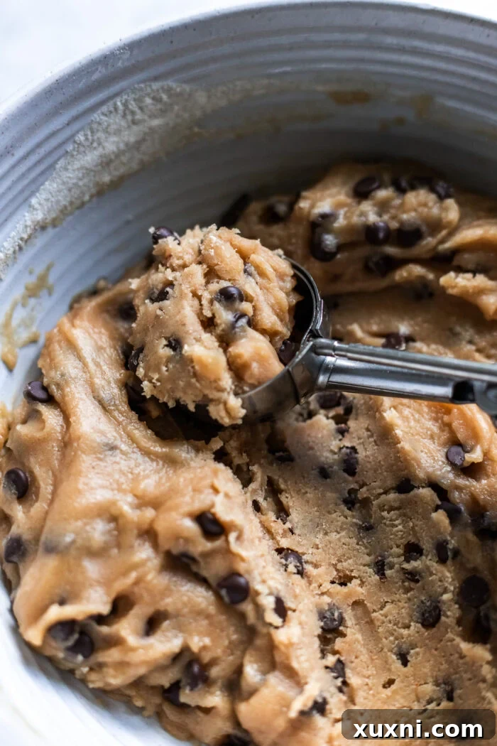 scooping the cookie dough