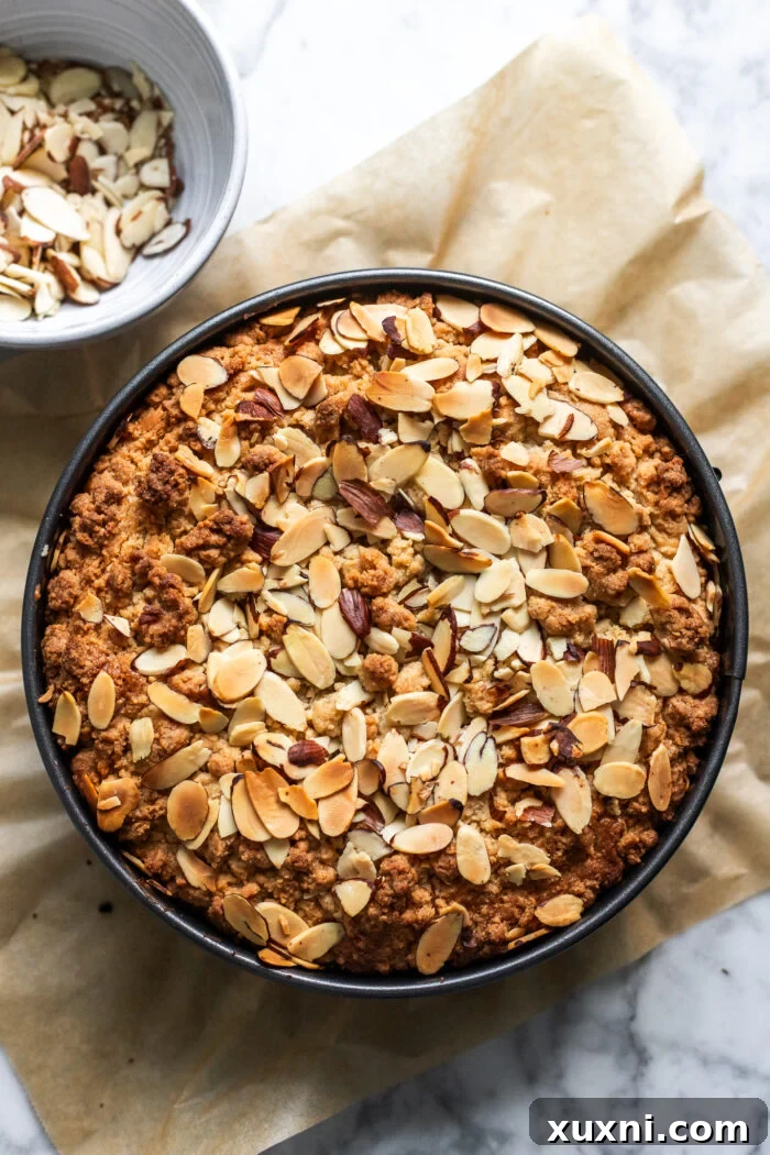 Freshly baked vegan almond coffee cake, golden brown and cooled.