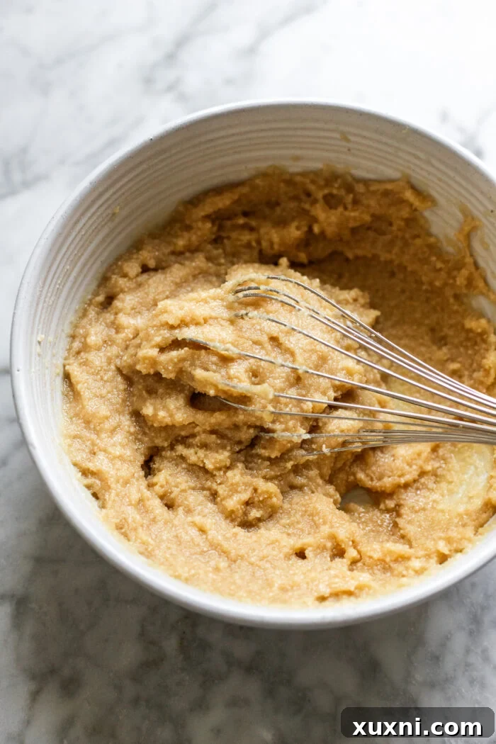 Frangipane filling being mixed in a bowl.