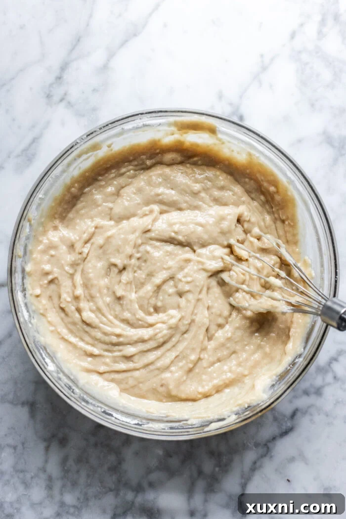 Smooth vanilla cake batter in a mixing bowl.