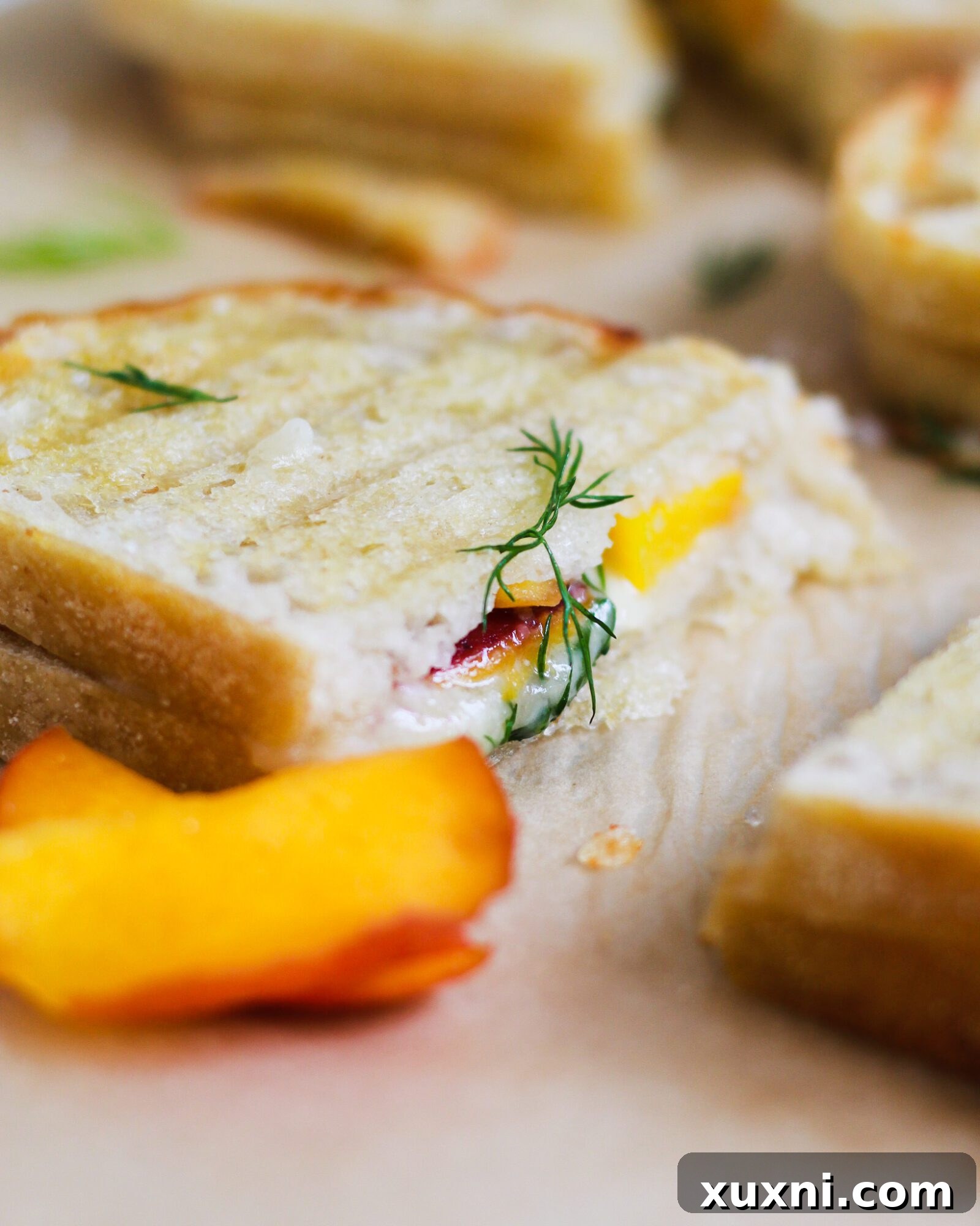 sliced grilled cheese on parchment paper