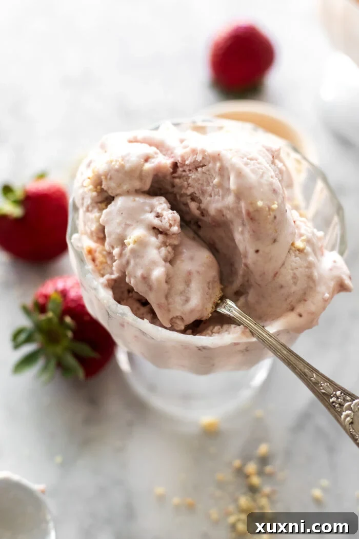 Close-up of freshly scooped vegan strawberry ice cream, showing its smooth texture