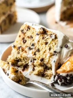 slice of vegan cannoli cake on a plate, beautifully garnished