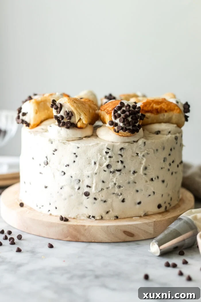 Mind-Blowing Vegan Cannoli Cake 3 frosted vegan cannoli cake with chocolate chips