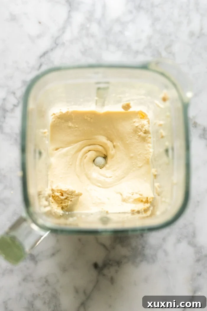 Mind-Blowing Vegan Cannoli Cake 6 smooth, whipped vegan ricotta in a bowl