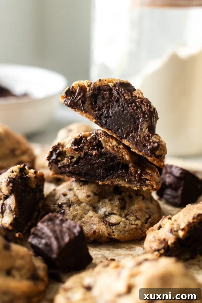 Vegan Brown Butter Brownie Cookie Fusion 3 Stacked vegan brownie stuffed cookies showcasing their rich texture