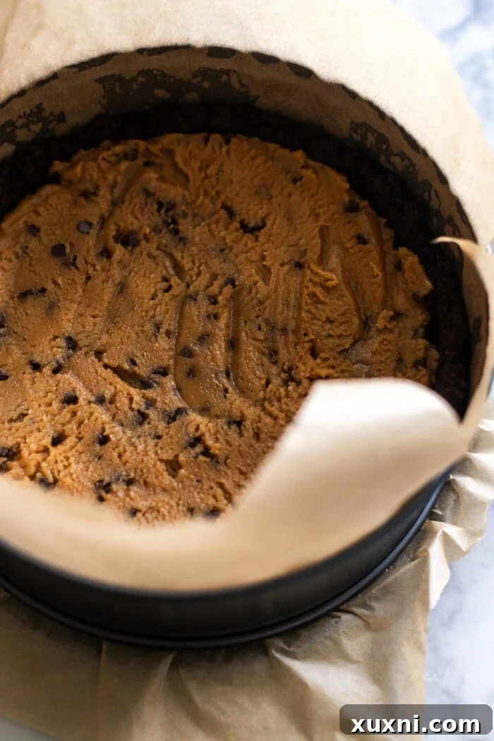 peanut butter cookie dough pressed into an Oreo crust