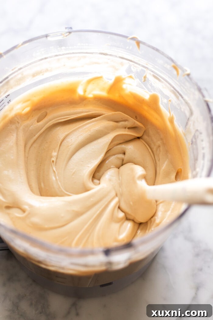 creamy cheesecake batter in a food processor