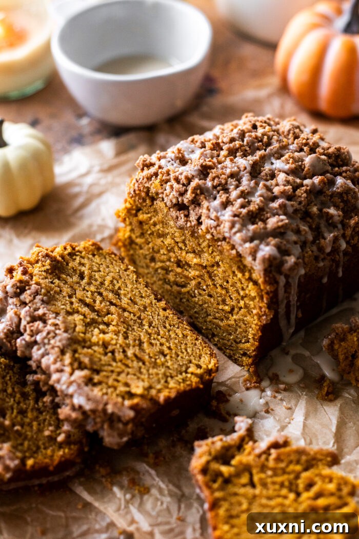 Super moist and tender, perfectly spiced vegan pumpkin bread, sliced and ready to enjoy, rivaling popular coffee shop versions.