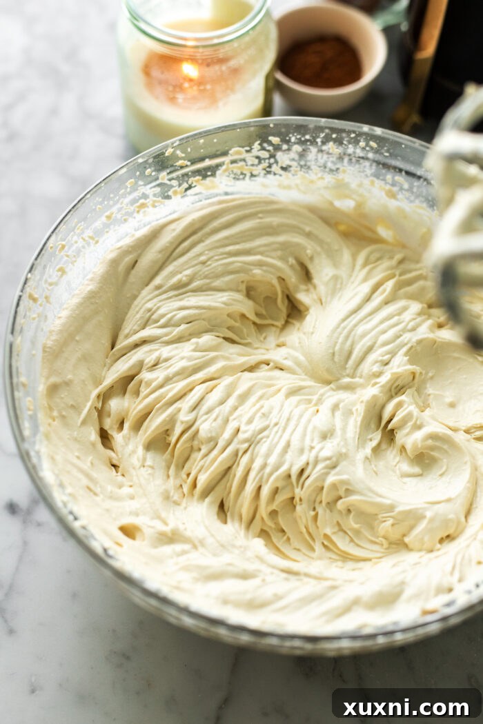 Image showing the precise process of whipping the vegan mascarpone and vegan heavy cream to a light and fluffy consistency, highlighting its airy volume.