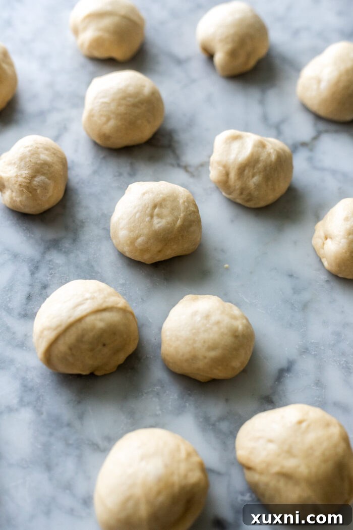 Unassembled monkey bread dough on a work surface, ready for shaping