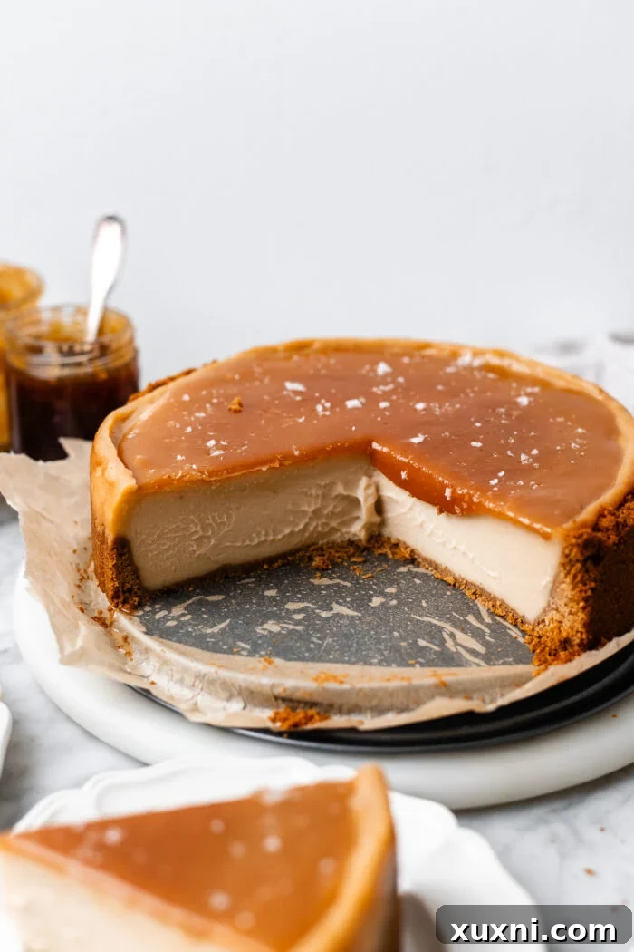 An elegantly sliced vegan caramel cheesecake, ready for enjoyment