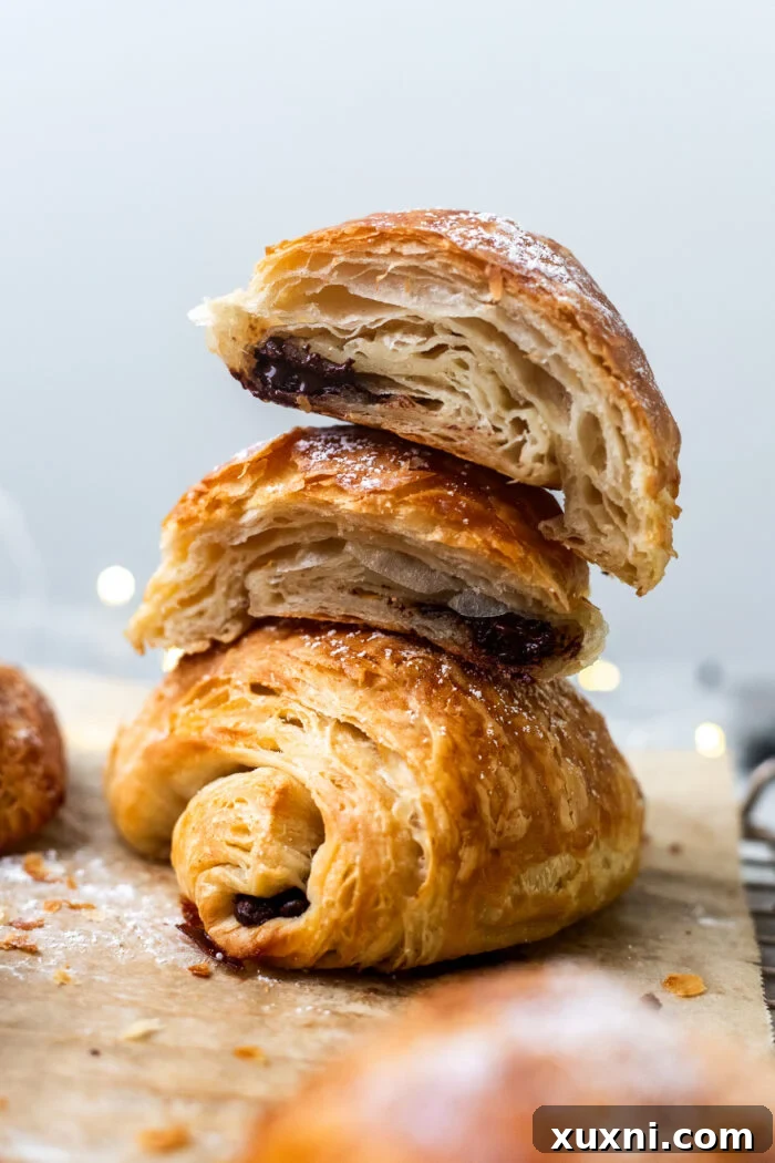 A stack of perfectly baked vegan croissants, golden and inviting, ready to be enjoyed.