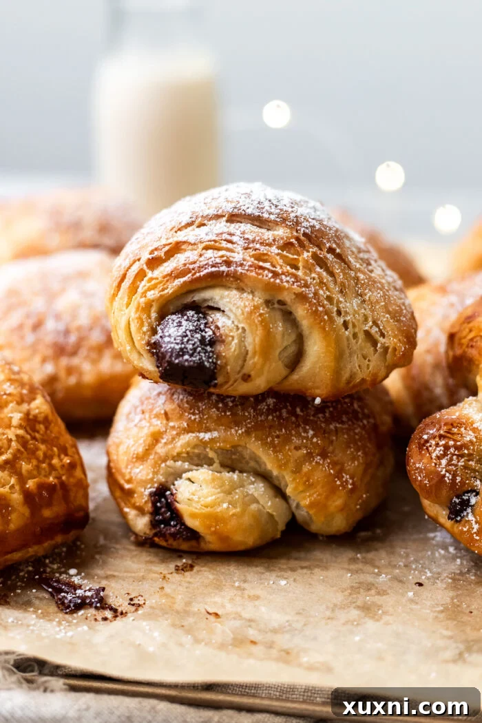 A delectable stack of golden, flaky vegan pain au chocolat.