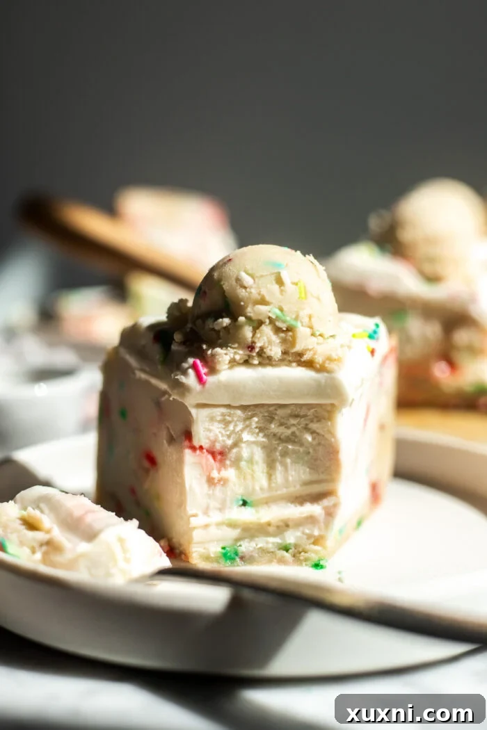 Close-up of a bitten slice of Vegan Sugar Cookie Dough Cheesecake, showing its creamy texture and embedded edible cookie dough.