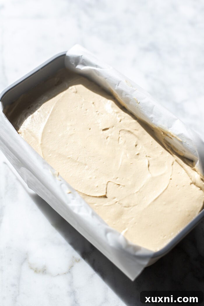 Spreading mascarpone cream on cooled brownies