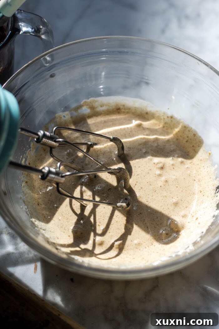 Mixing aquafaba and sugar for brownie batter