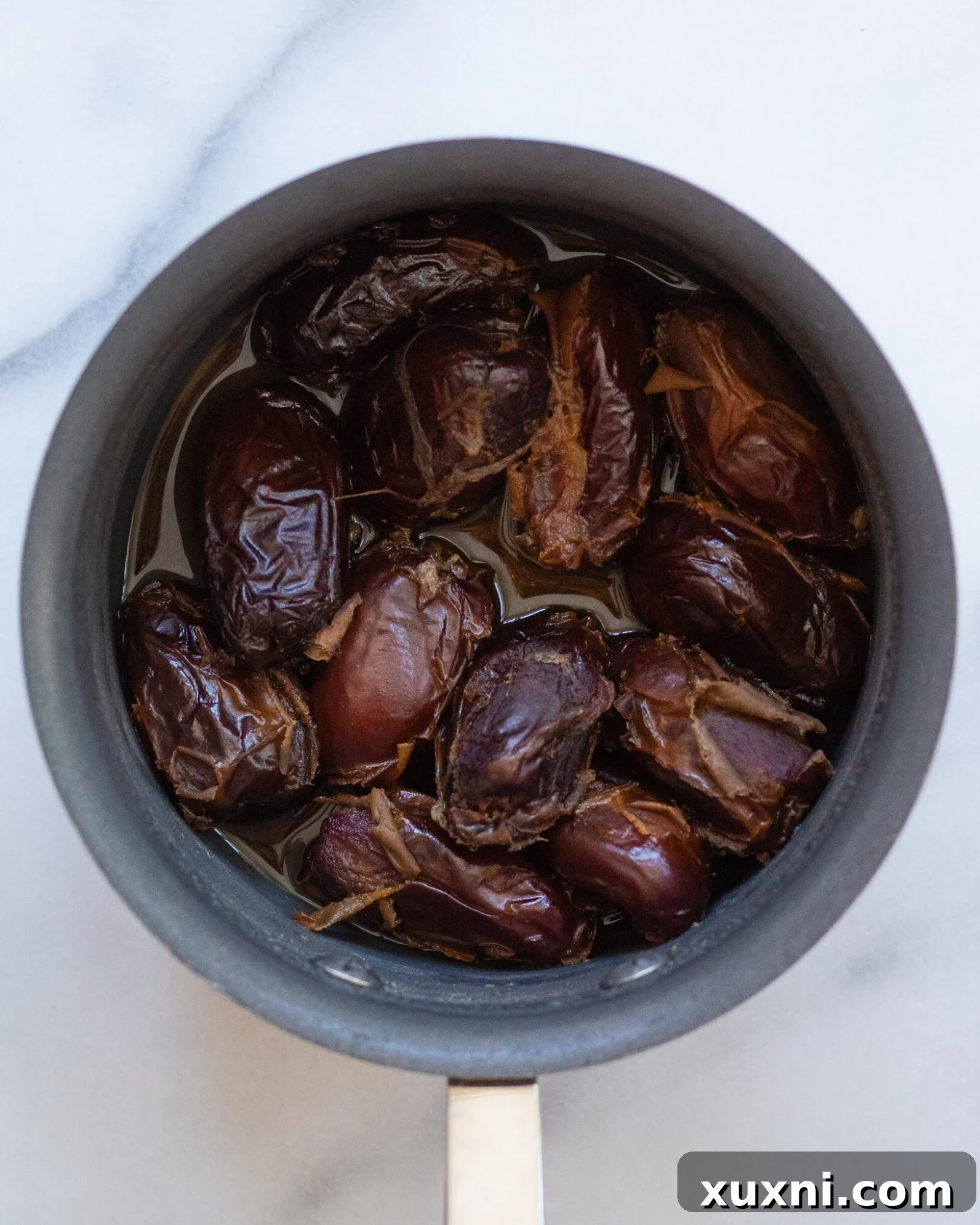 cooked dates in a sauce pan