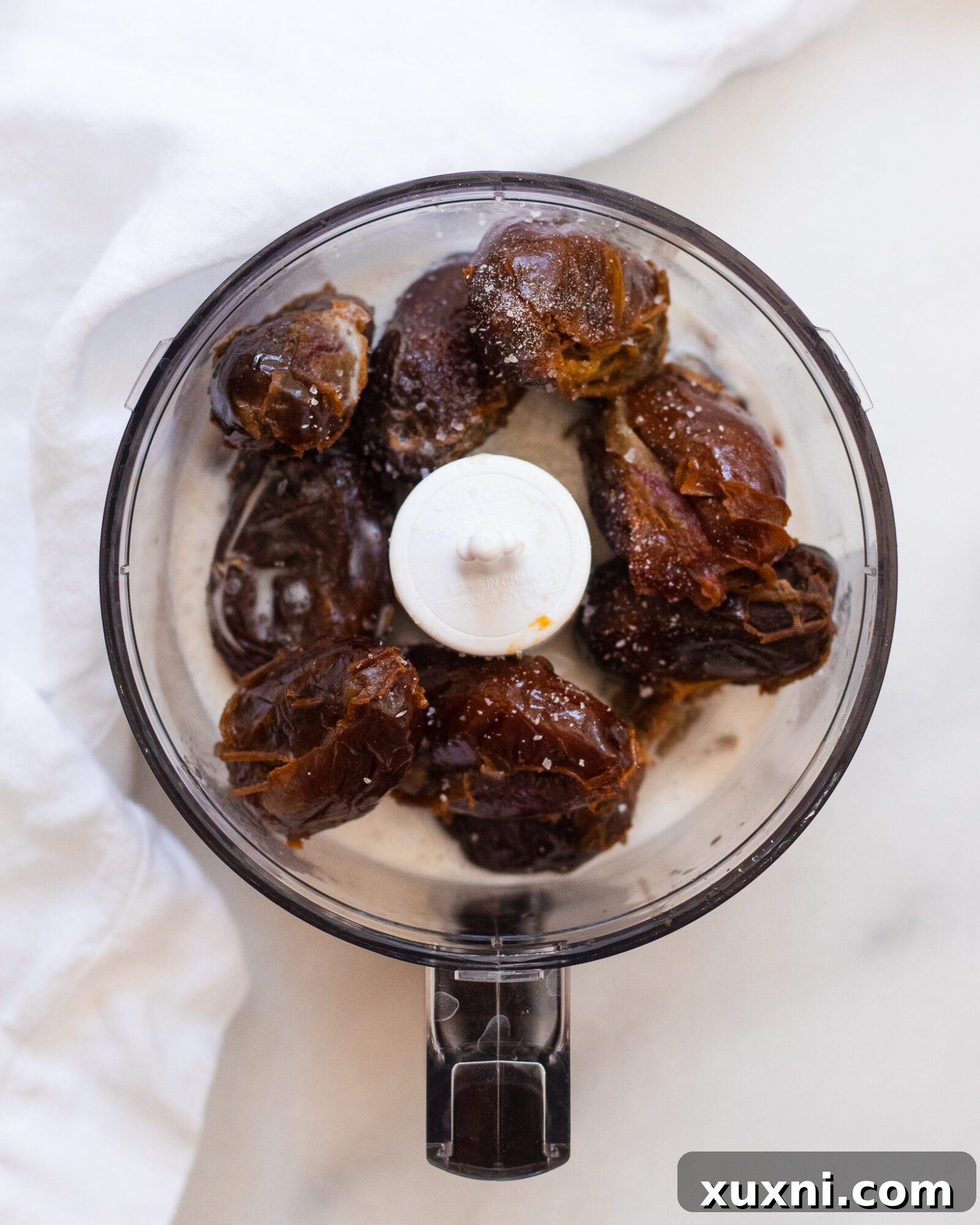 food processor with dates and coconut cream 