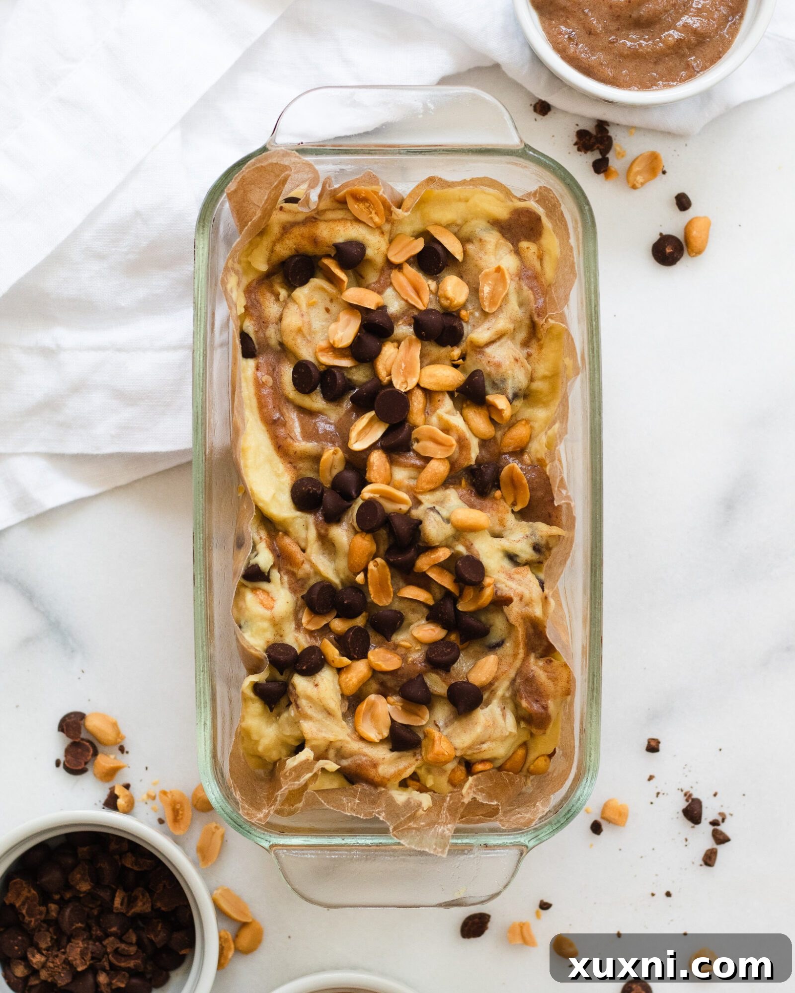 container of homemade snickers ice cream