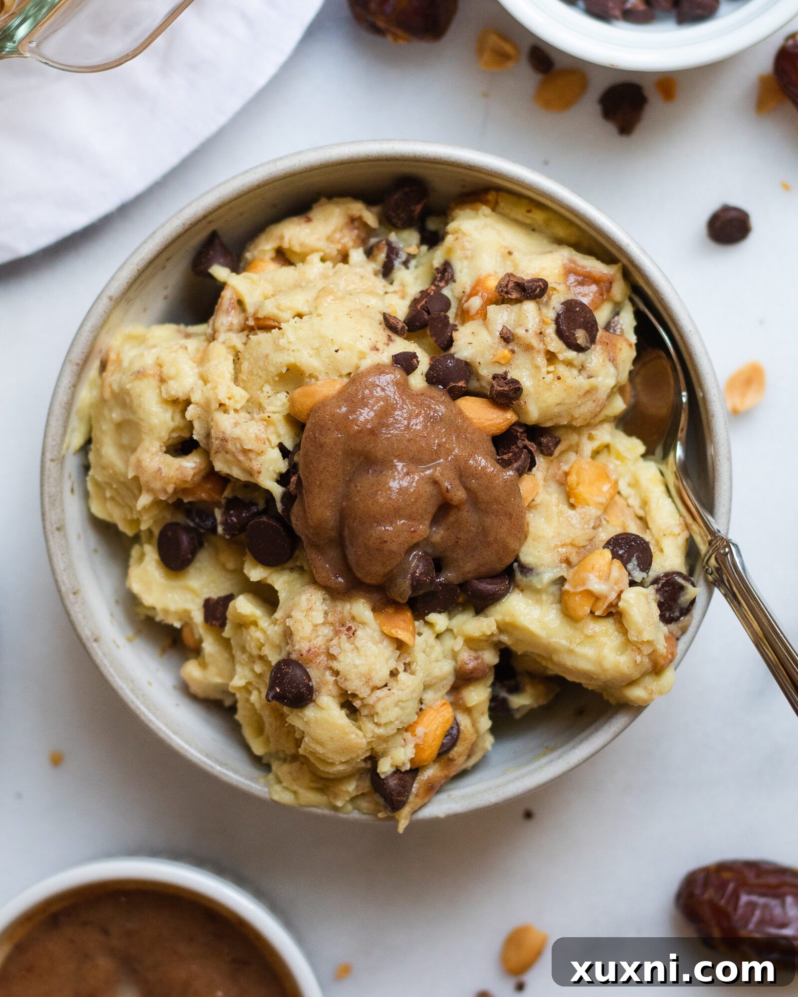 overhead of snickers ice cream topped with caramel sauce
