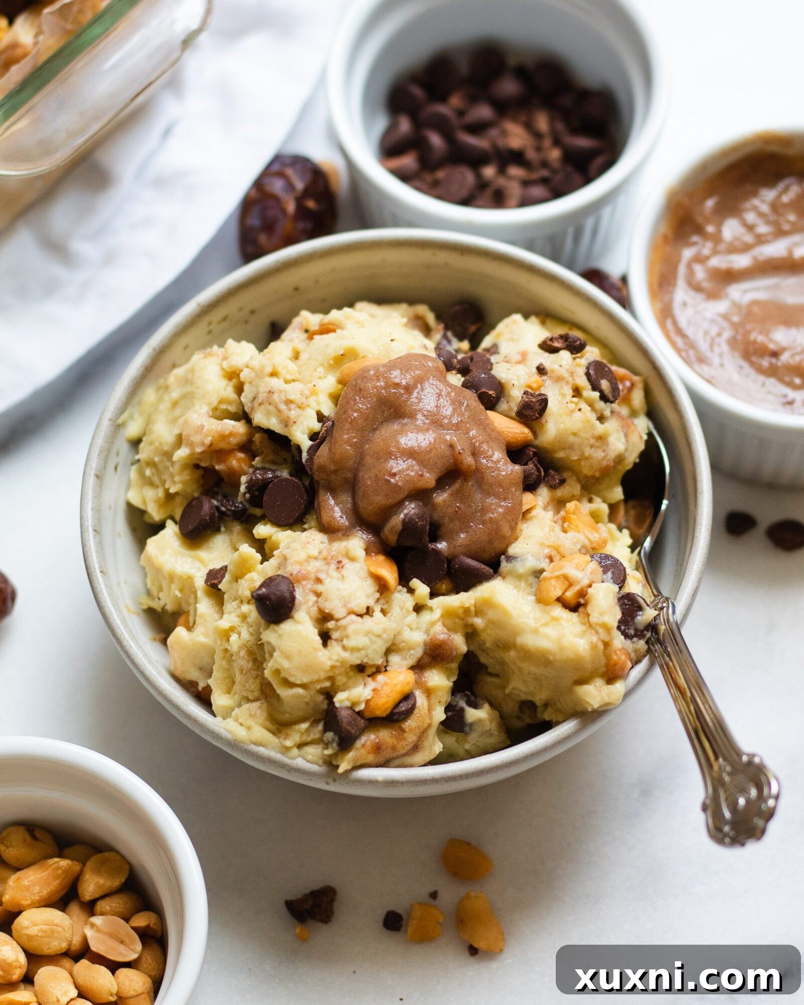 bowl of vegan Snickers ice cream with toppings