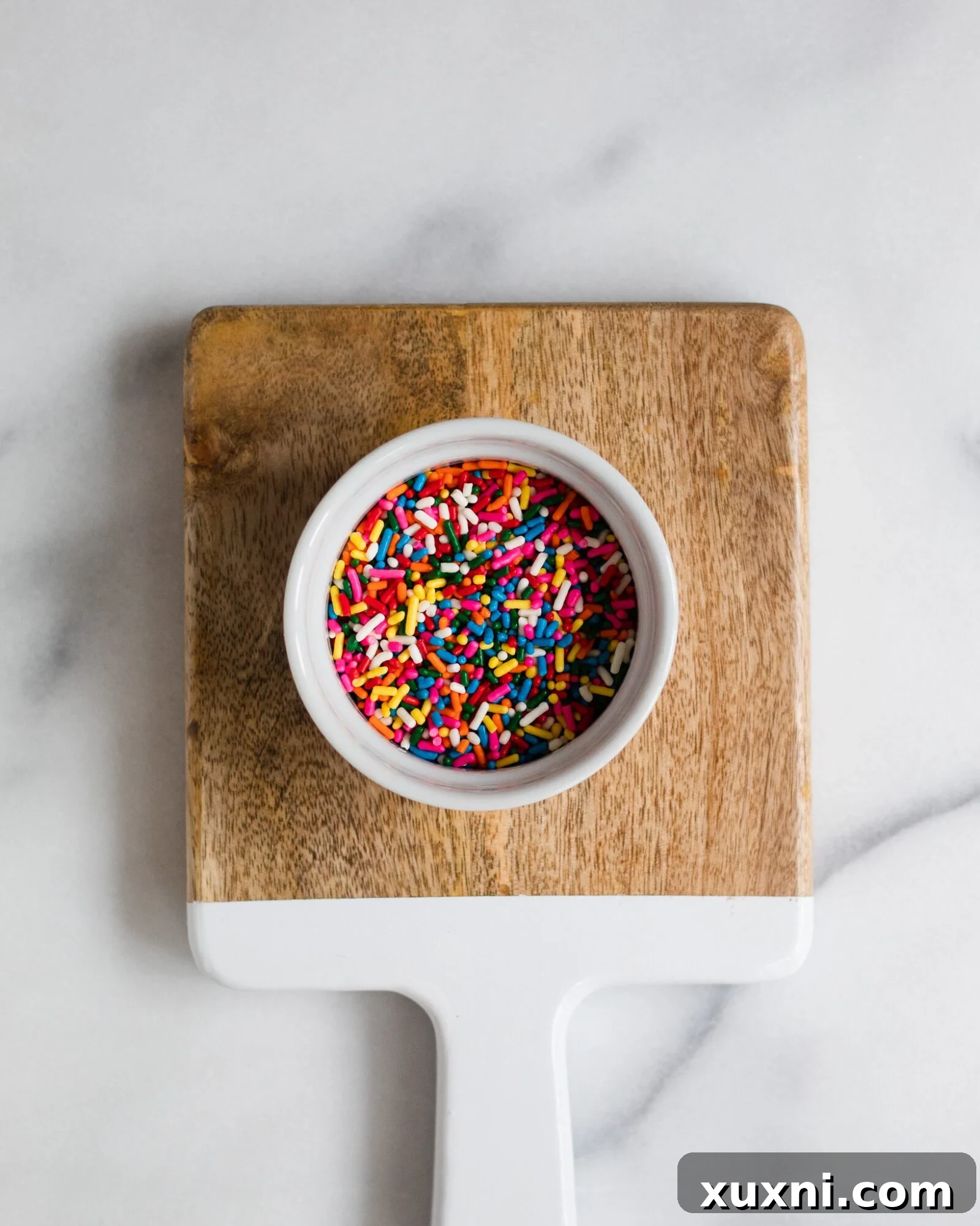 Vegan Birthday Donut Delights 9 bowl of rainbow sprinkles on cutting board