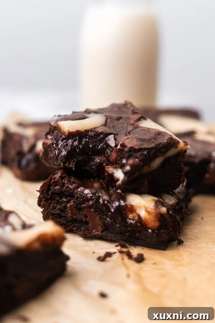 bitten cheesecake brownie on another brownie