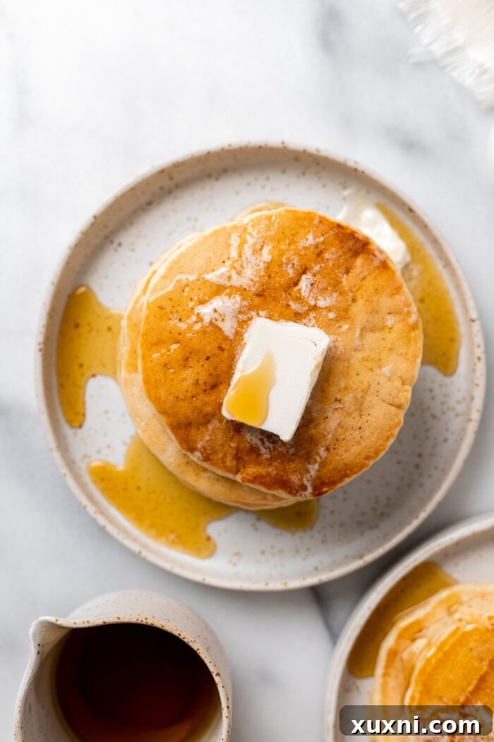 Overhead view of a beautiful stack of fluffy vegan pancakes ready to be served