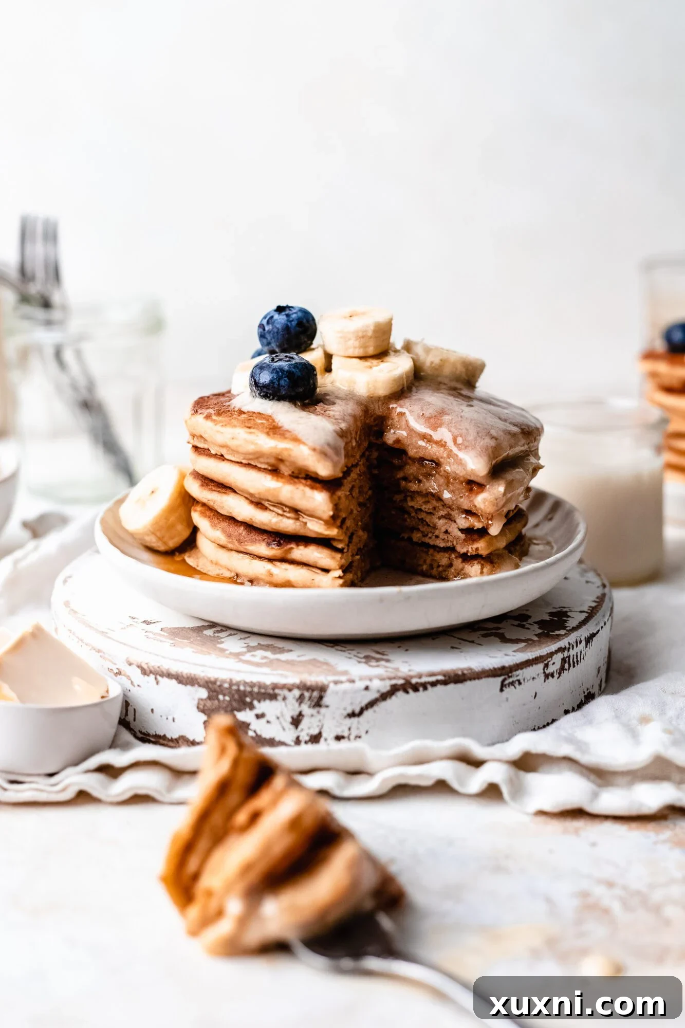 Cross-section of sliced fluffy vegan buttermilk pancakes, showcasing their texture