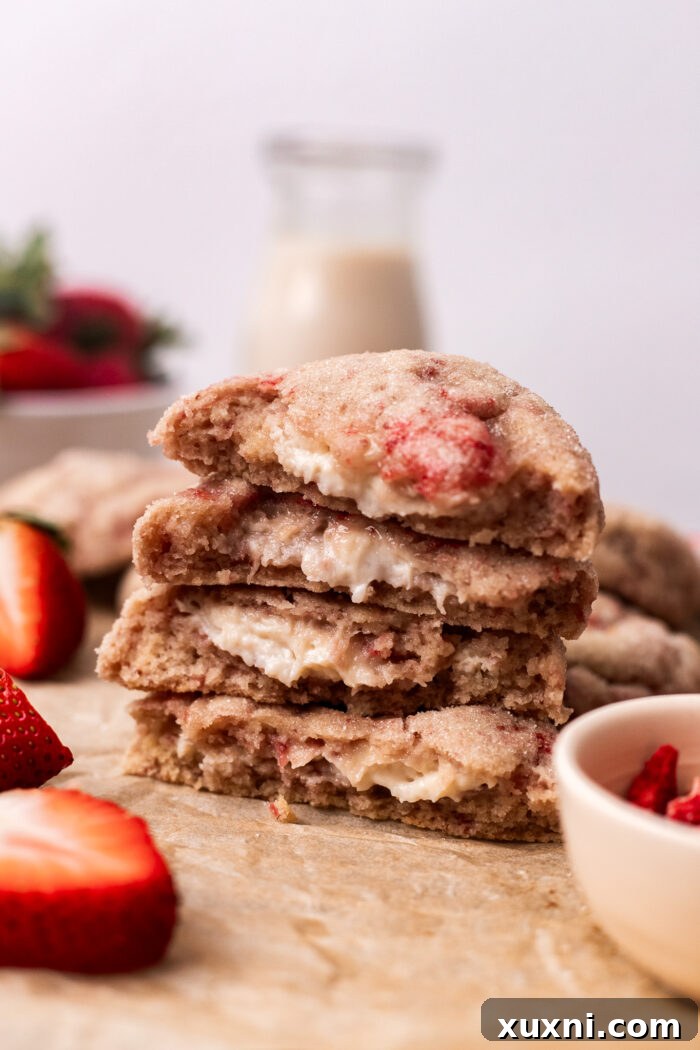 stacked strawberry cheesecake cookies in half