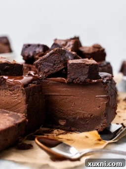 A perfectly sliced small batch vegan brownie Basque cheesecake ready to be enjoyed.