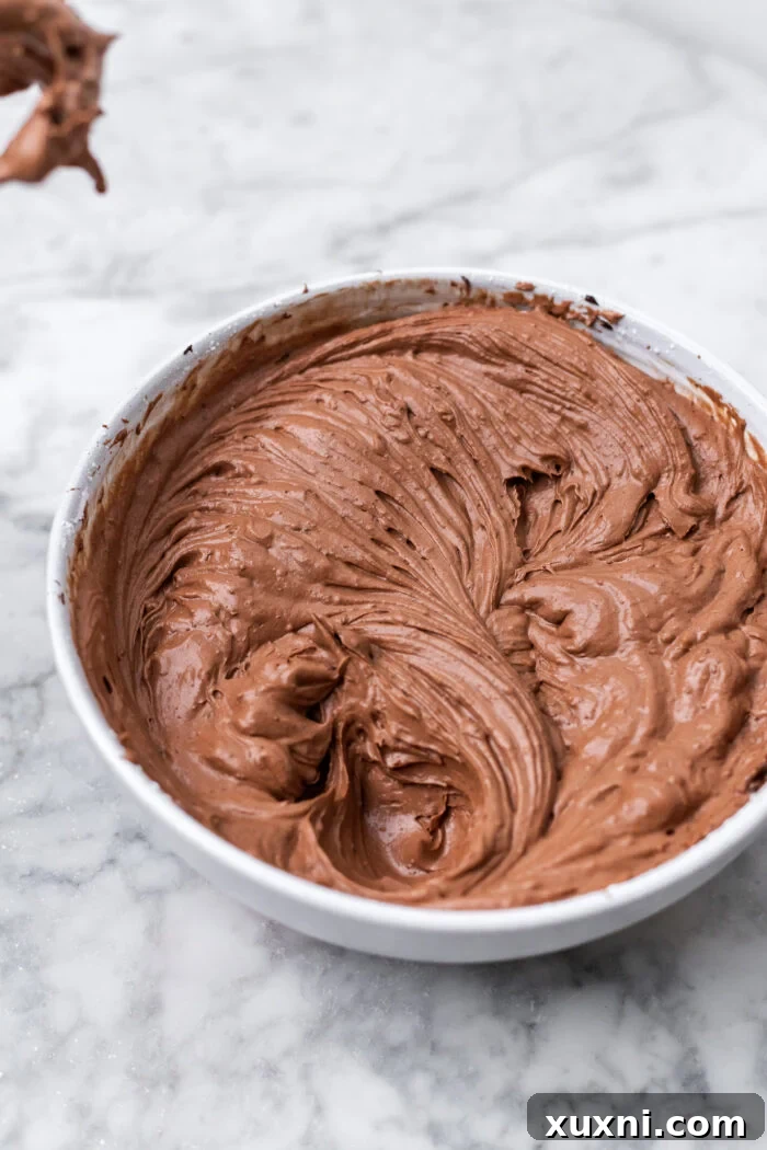 Smooth and creamy chocolate Basque cheesecake batter in a bowl.