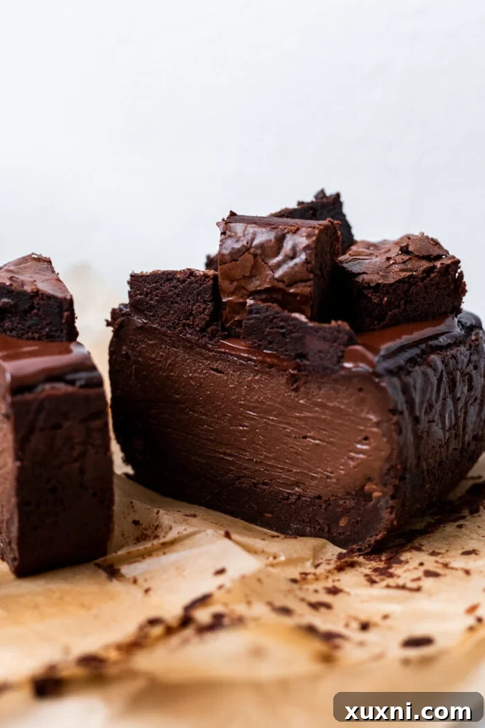 A perfectly sliced cross-section of the vegan brownie Basque cheesecake, showcasing its distinct layers.